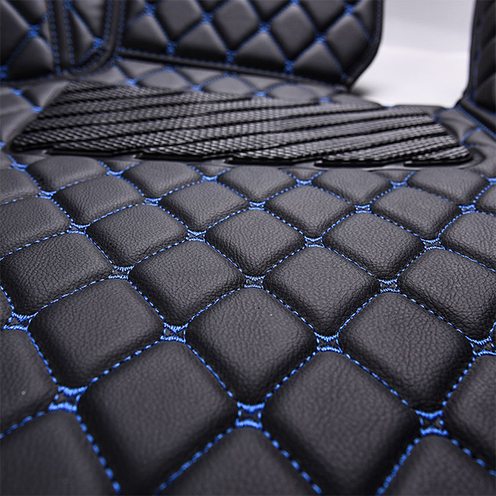 https://indymats.us/wp-content/uploads/2022/10/Black-Leather-and-Blue-Stitching-Diamond-Car-Mats-Closeup.jpg
